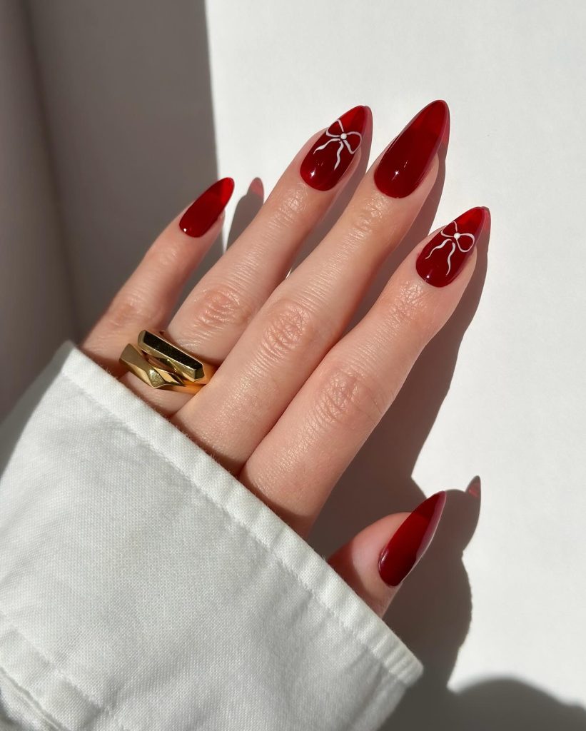 red jelly nails with with white bow