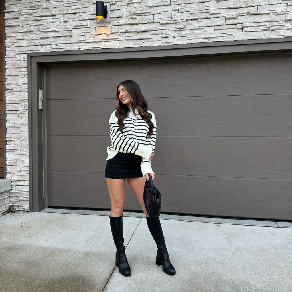 white sweater with high boots